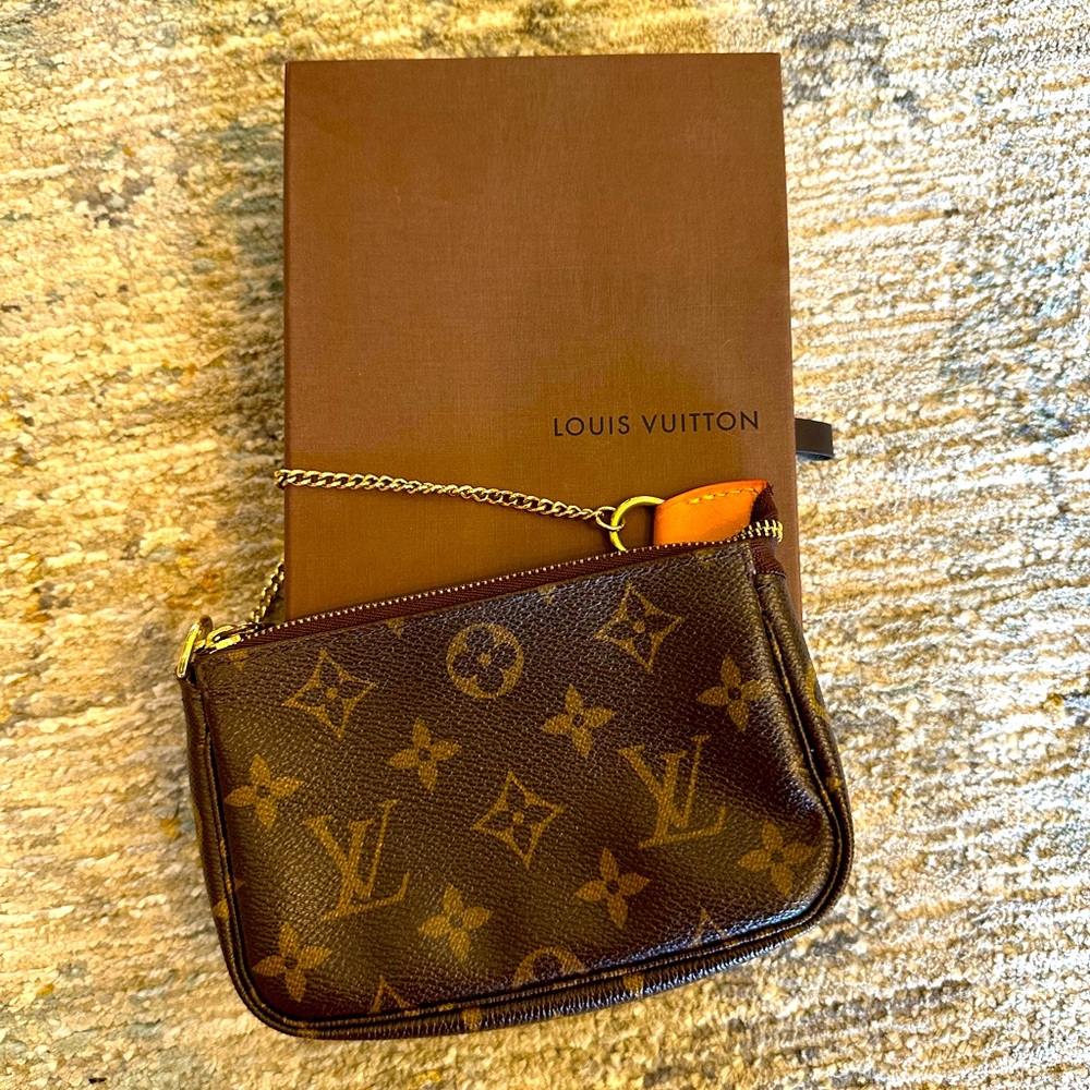 Louis Vuitton Mini Pochette on a chain